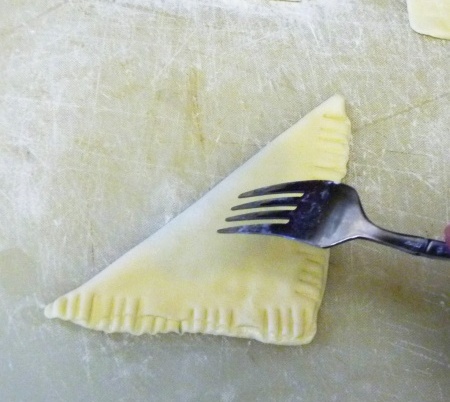 Piercing a turnover with a fork