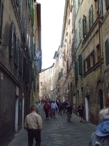 Street in the historic district of Siena, Italy