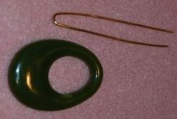 Jade pendant and piece of wire